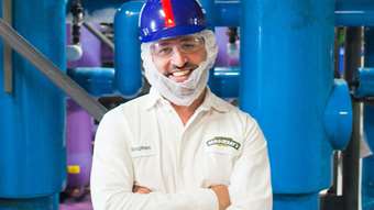 A man in health and safety gear smiles