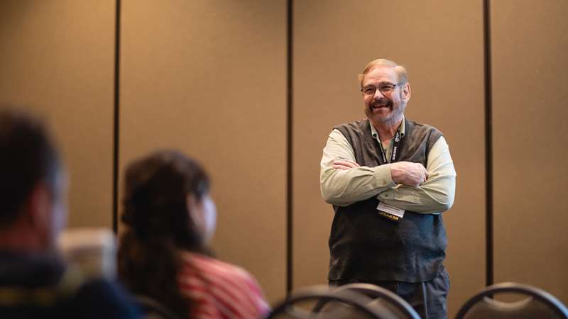 A speaker at a conference session
