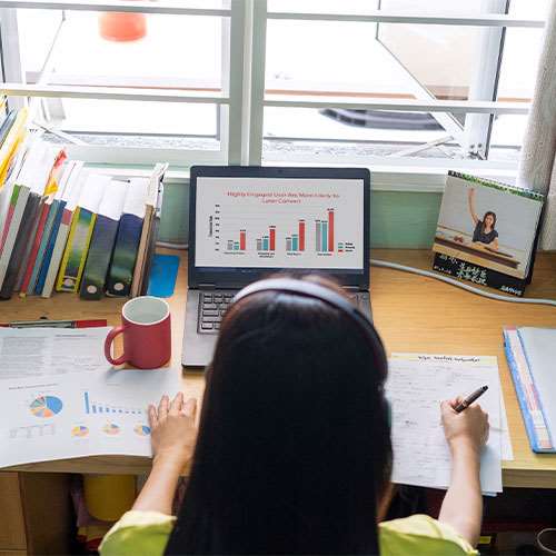A woman working on financial spreadsheets