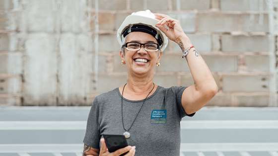 woman in a hard hat and safety glasses 