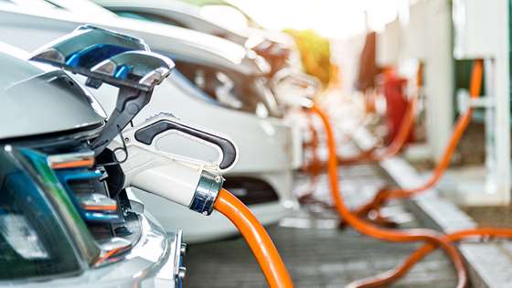 Several electric vehicles charging at the same time