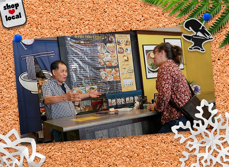 A corkboard with a pinned photo of Pho Thai Express