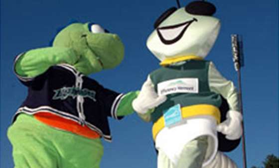 Champ the lake monster mascot dances with Wattson the Efficeincy Vermont mascot