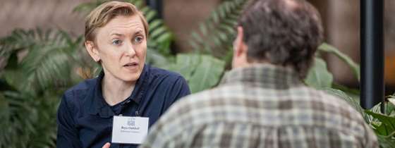 Bryn Oakleaf talks to a partner at the Better Buildings by Design conference