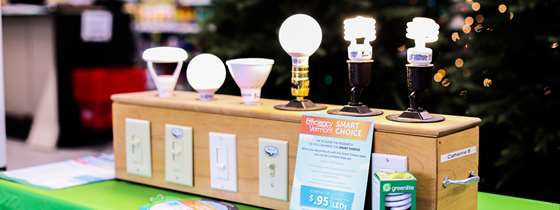 a light box display of different light bulbs with switches below 