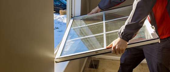 an older window being removed from its frame