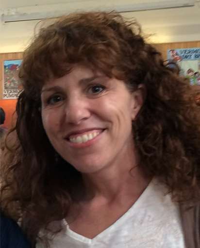 photo of a curly haired woman 