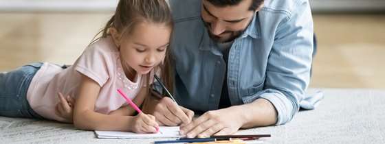 Father and daughter work together on energy activities for kids