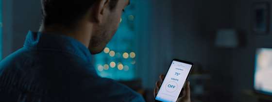 A man looks an app on his smartphone