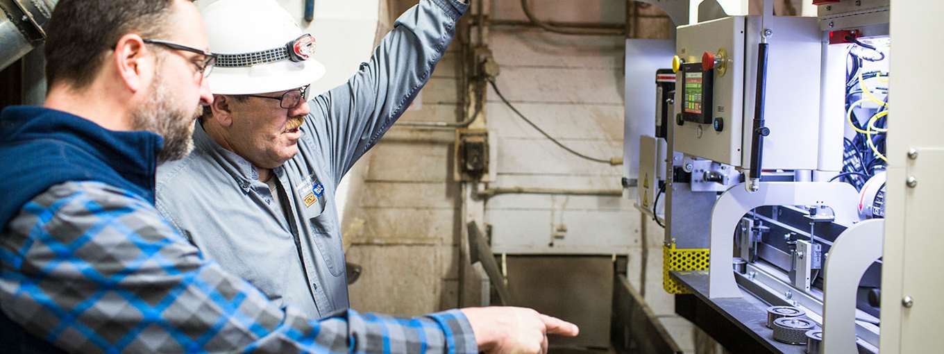 Dan Turcotte points out some of the features of the Blue Seal warehouse