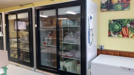 The new refrigerators filled with food inside the food shelf