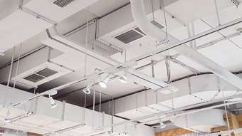 all white commercial building ductwork for a HVAC system