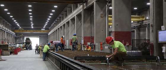 view of workers and lighting in a warehouse