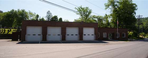 former Wilmington Fire Station, and older style brick building with large garage doors for fire trucks
