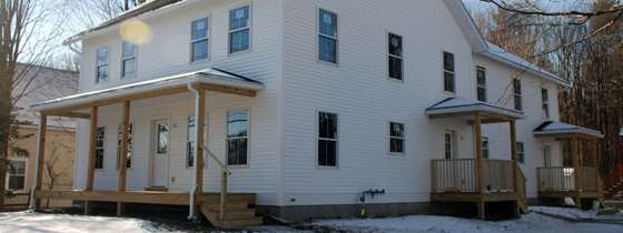 The exterior of a new Habitat for Humanity home in winter