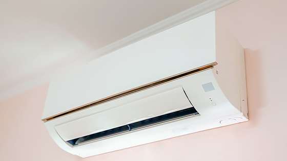 A heat pump mounted on a wall