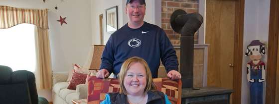Jessica and Kevin sit in their living room
