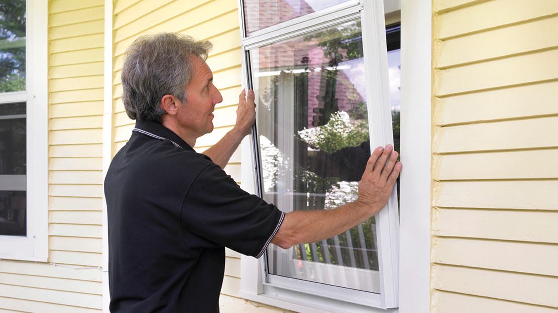 Can New Storm Windows Save You Money Efficiency Vermont Photo Of Storm Window Being Installed