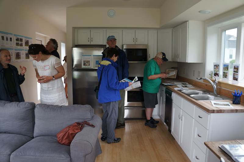 Photo of people insde a ZEM model home