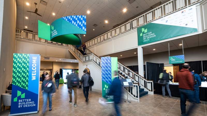 Photo of attendees in the lobby of Better Buildings by Design