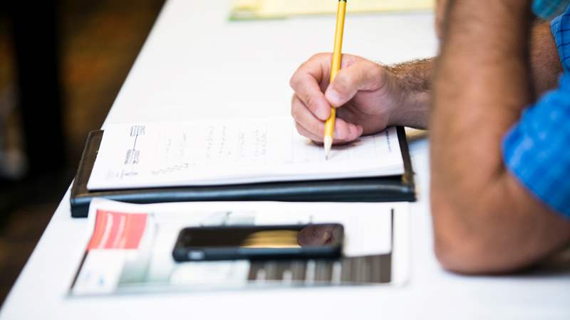 Photo of a contractor doing calculations